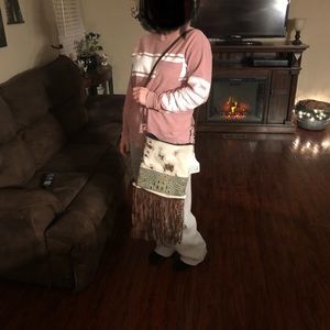 Holy cow couture fringe purse.